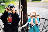 2 boys show off their fishing catch of the day